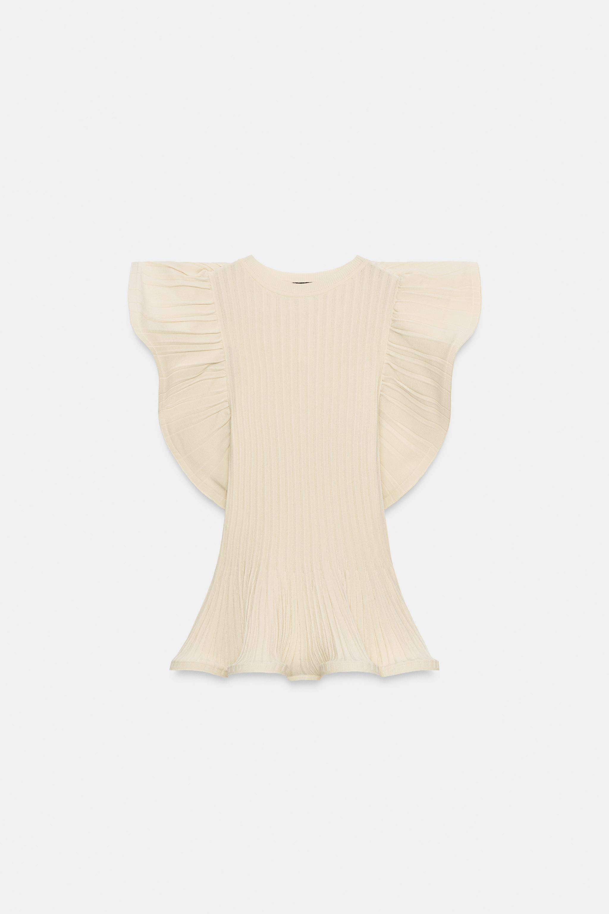TOP EN MAILLE À FINITIONS ONDULÉES